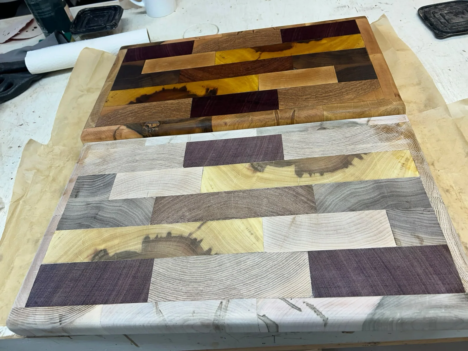 Original handcrafted multi-wood geometric mosaic cutting board